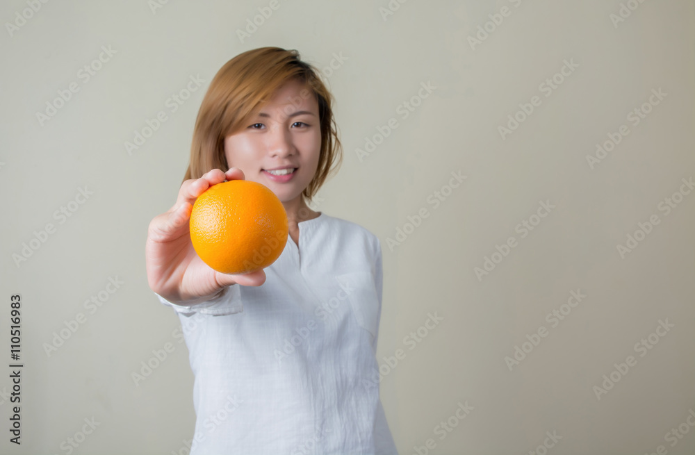 Portrait of pretty woman smile holding orange fruit Portrait of pretty woman smile holding orange fruit