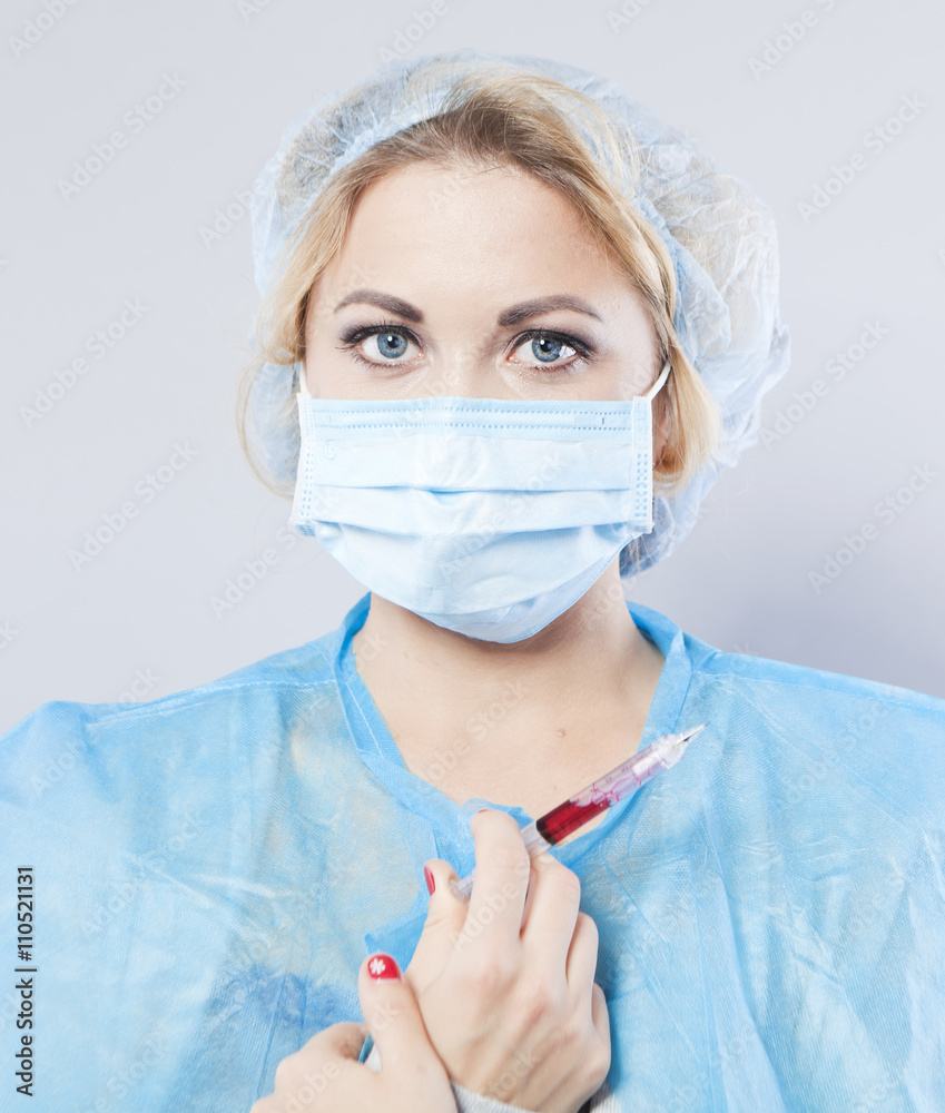 Young nurse in blue cap and bandage. Doctor. Vaccination
Young nurse in blue cap and bandage. Doctor. Vaccination