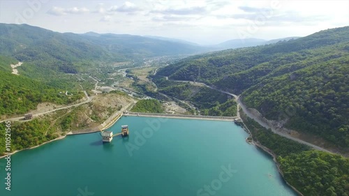 Wallpaper Mural Aerial view of Zhinvali water-power plant on river Aragvi, Georgia, renewable energy source. Camera flies on drone above mountains river. Torontodigital.ca