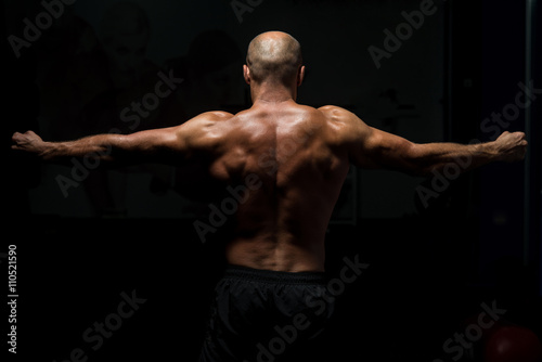 Back View OF A Muscular Man Praying