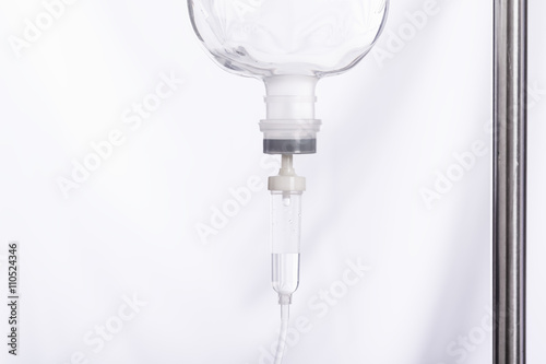 Close up saline IV drip for patient in hospital with copy space photo