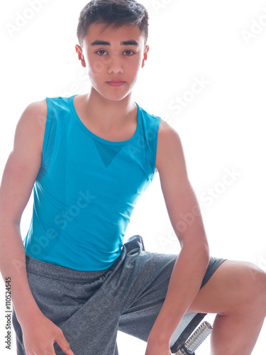 teenage boy during muscle building exercise