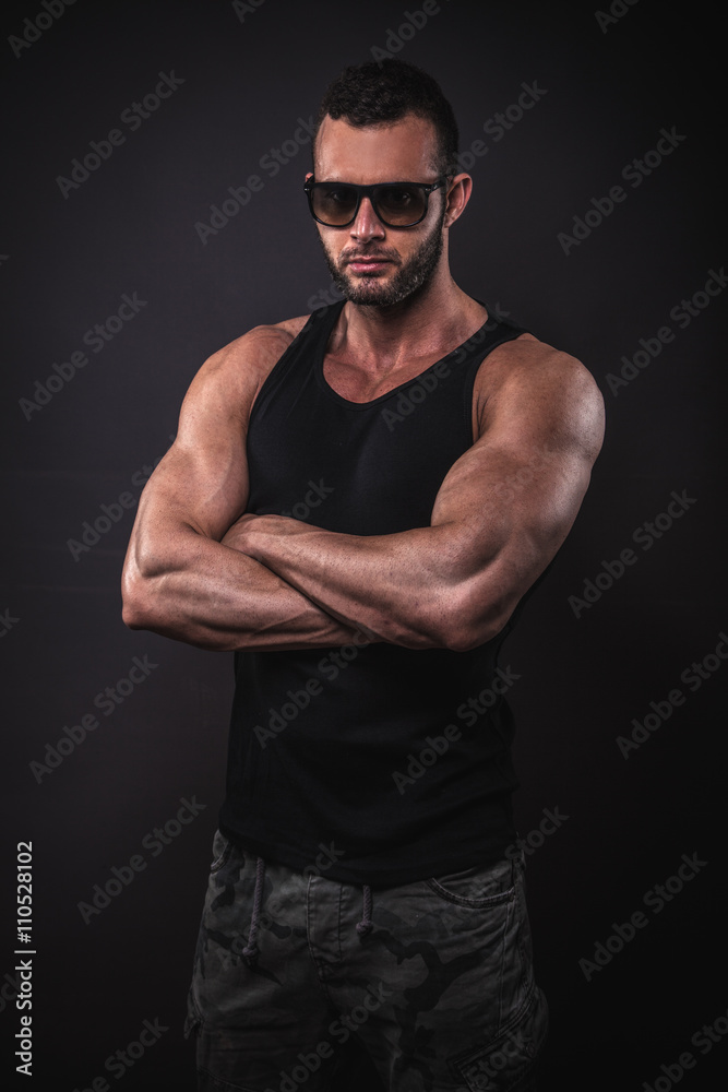 Handsome muscular man posing in studio.