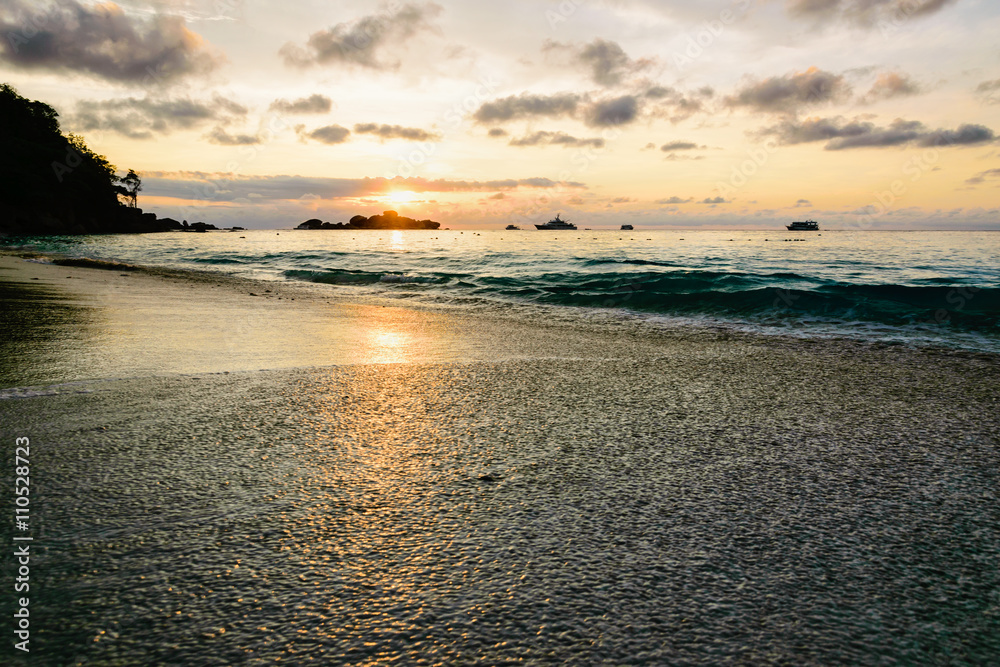 Beautiful landscape morning sky over the sea and beach at Honeymoon Bay during sunrise is a famous attractions for diving on Miang island in Mu Koh Similan National Park, Phang Nga Province, Thailand