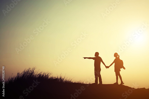 silhouette of couple go to travel together.