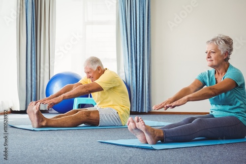 Side view of seniors doing exercises 