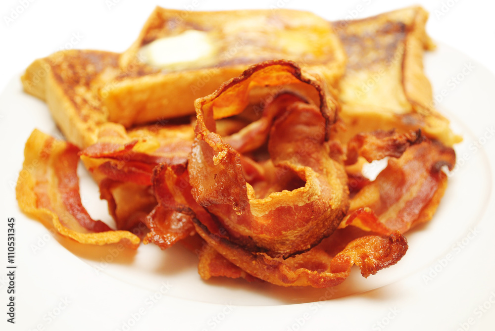 Crispy Fried Bacon with French Toast in the Background