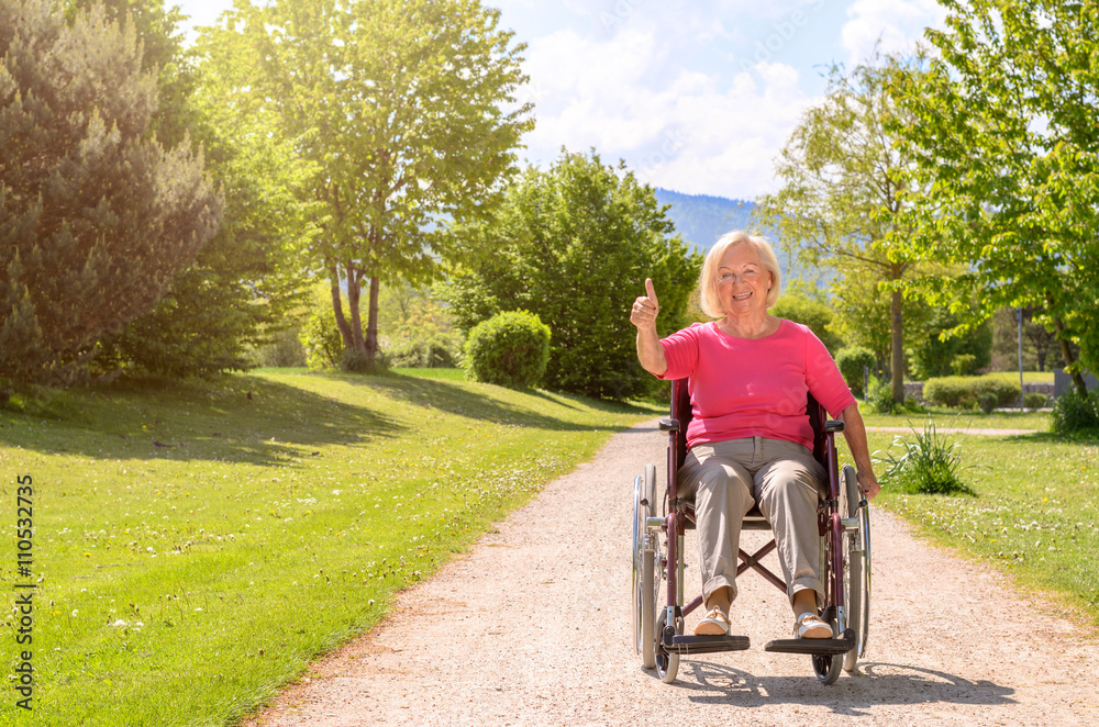 White haired elderly woman seated in wheel chair White haired elderly woman seated in wheel chair