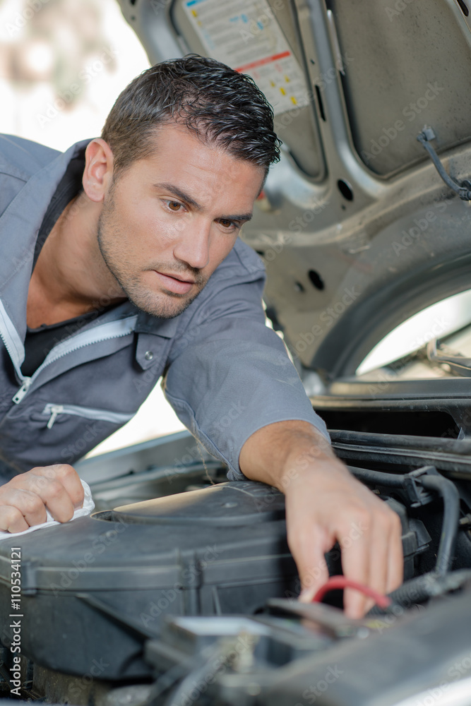 mechanic working in engine bay mechanic working in engine bay