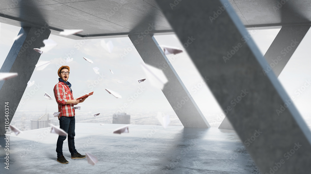 Fototapeta premium Hipster guy with book in hands
