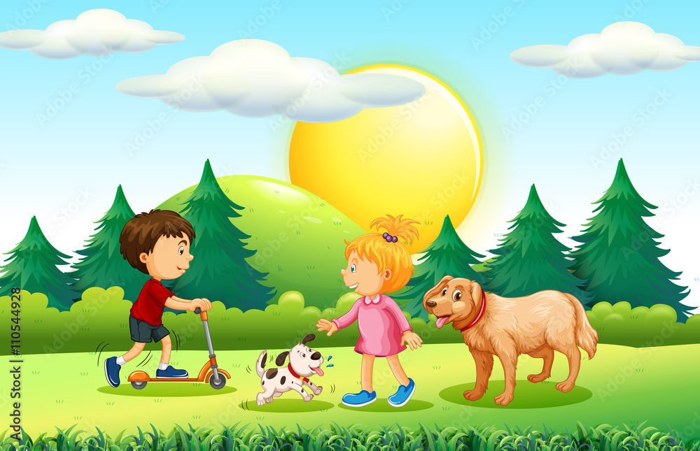 Fototapeta premium Boy and girl with pets in the park