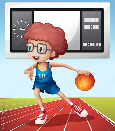 Boy playing basketball in the field