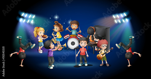 Children in band playing on stage © GraphicsRF
