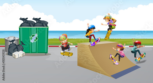 Kids playing skateboard on the ramp