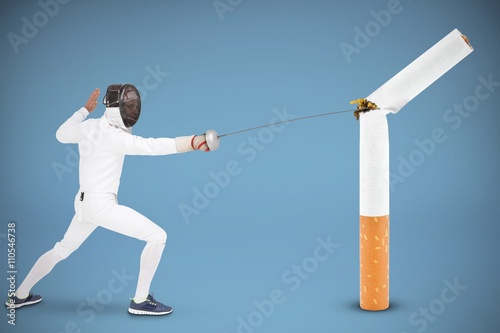 Composite image of man wearing fencing suit practicing with swor photo