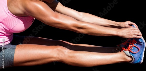 Close up of sportswoman stretching her muscles 