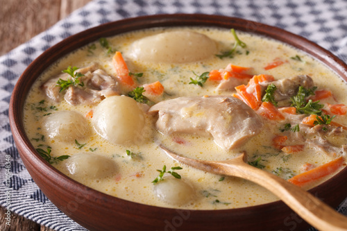 Belgian WATERZOOI soup with chicken close up in a bowl. horizontal
