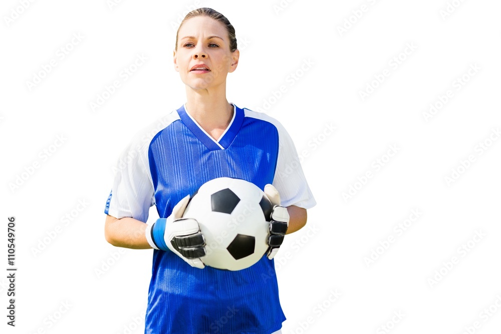 Woman goalkeeper posing with a ball