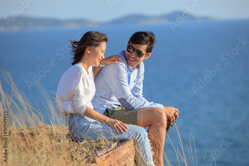 portrait of asian younger man and woman relaxing vacation at sea side happiness emotion