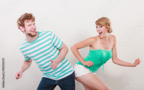 Playful young couple blonde girl bearded man