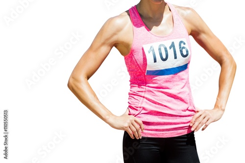 фотографія Portrait of sportswoman chest is posing with hands on hips