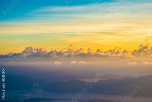 Colourful Sunrise on mountains with blue sky