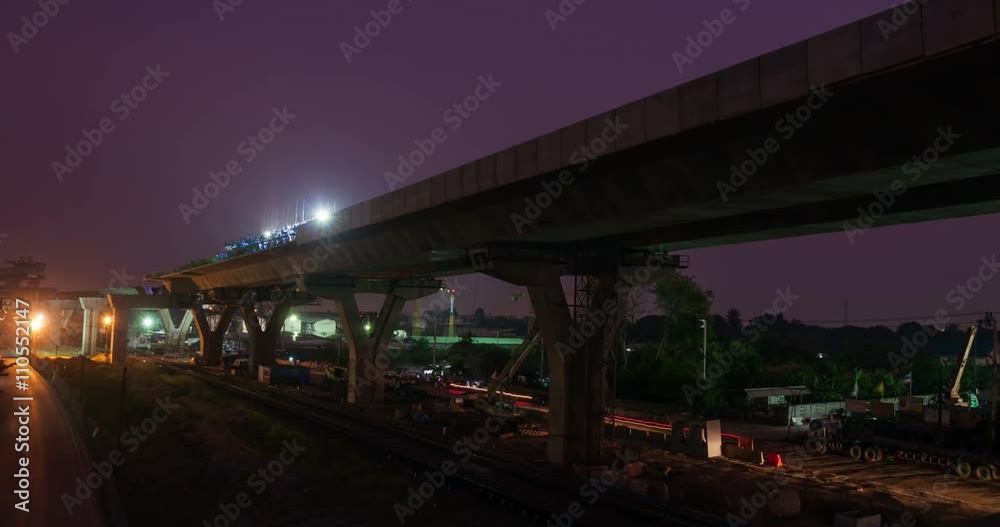 Timelapse night to dayt at express way construction site over rail road in Bangkok, Thailand Timelapse night to dayt at express way construction site over rail road in Bangkok, Thailand