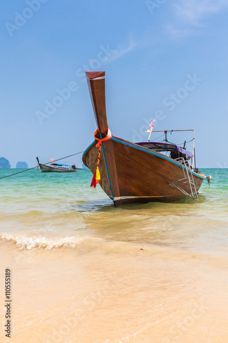 Traditional long-tail boat on the Ao Nang beach, Krabi, Thailand © Elena Ermakova