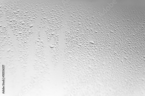 Many Water Drops on Grey Glass