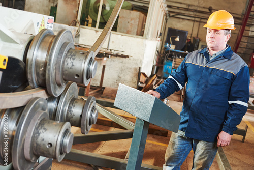 Bild auf Leinwand industrial factory worker with tube bending machine