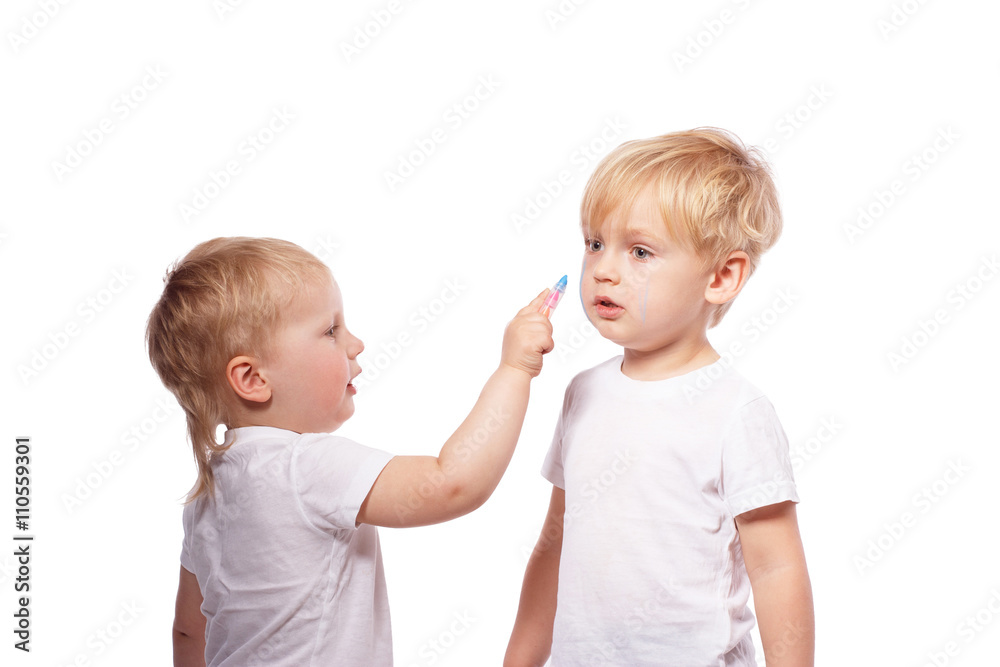Children draw colored chalk on each other Children draw colored chalk on each other