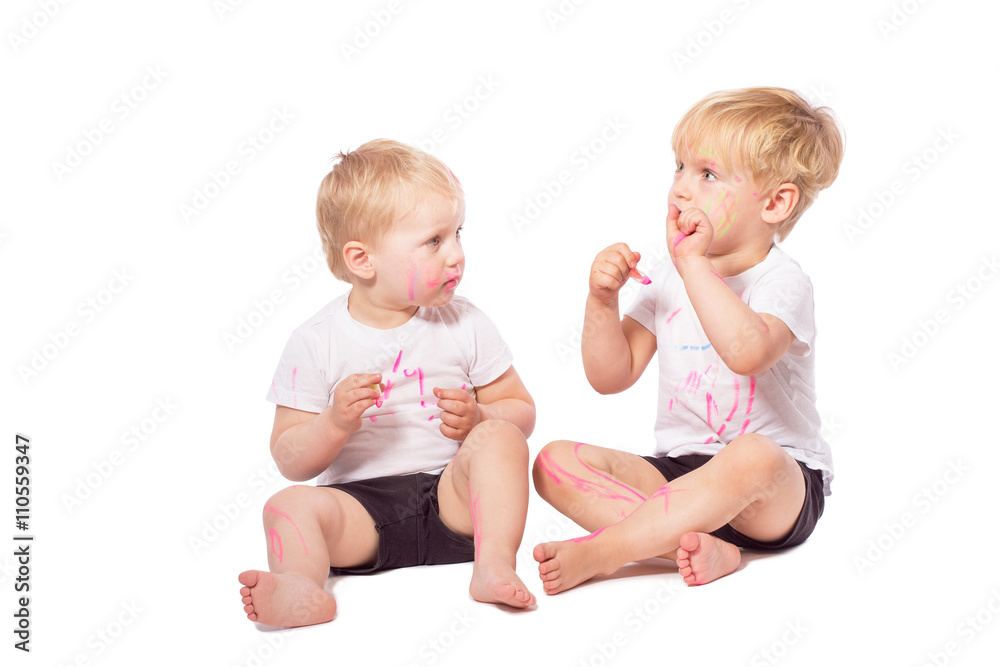 Children draw colored chalk on each other Children draw colored chalk on each other