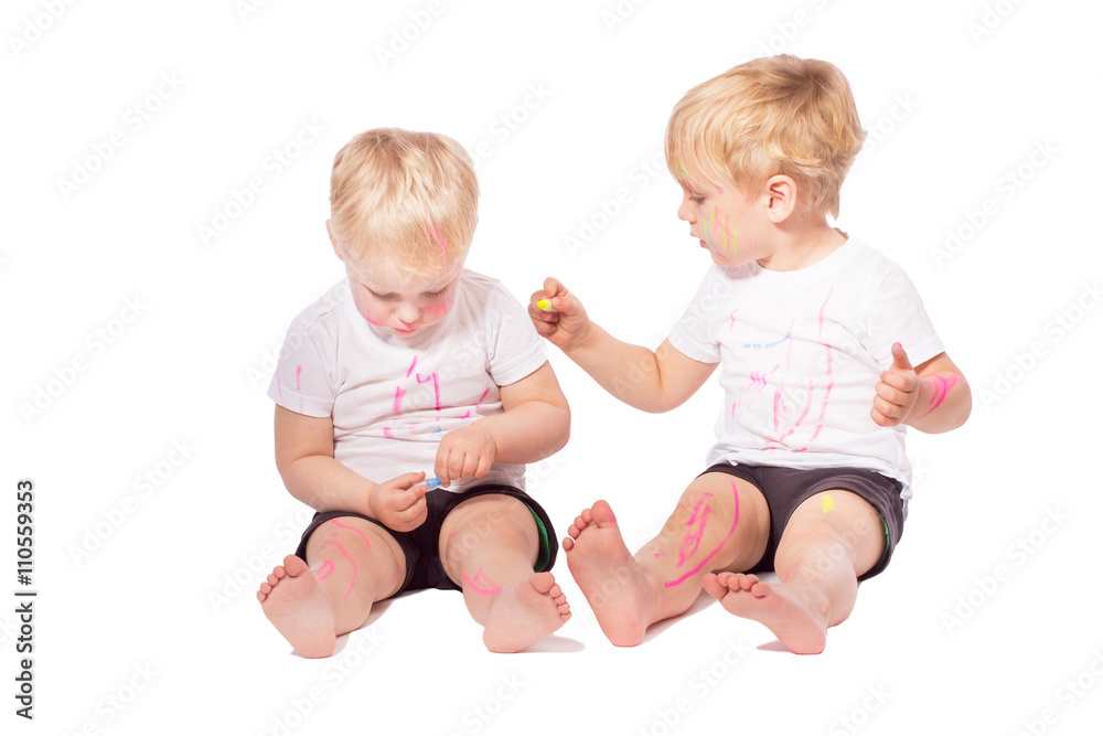 Children draw colored chalk on each other Children draw colored chalk on each other