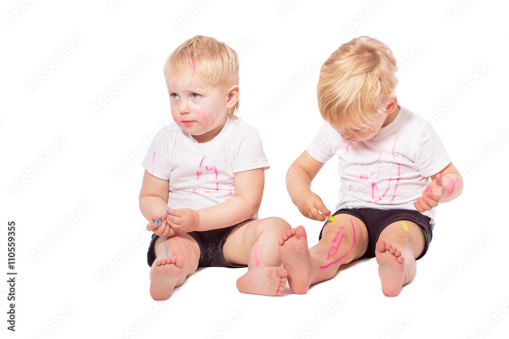 Children draw colored chalk on each other Children draw colored chalk on each other