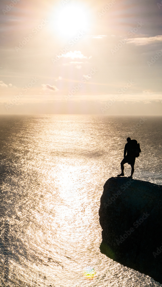 Young Caucasion Adult Standing on the Cliff