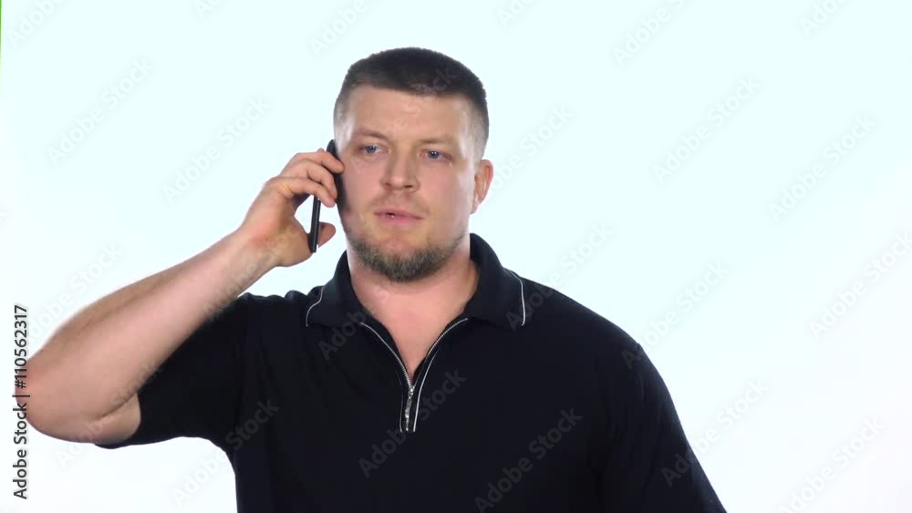 The guy in a shirt talking on the phone. White. SLow motion The guy in a shirt talking on the phone. White. SLow motion