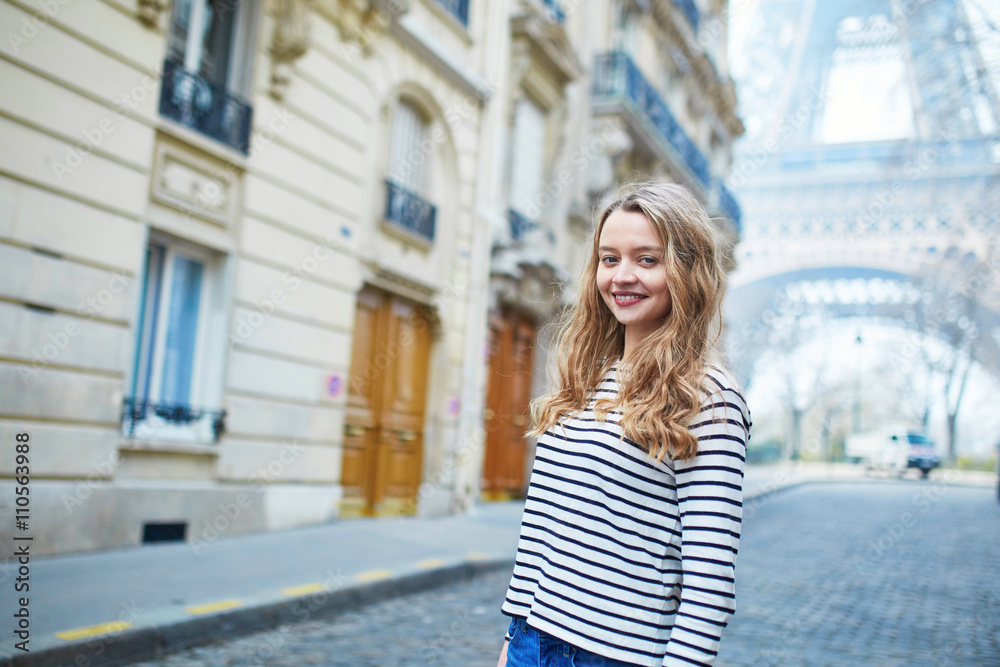 Girl outdoors near the Eiffel tower, in Paris