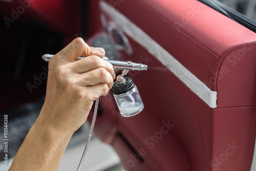 Car detailing series : Closeup of hand coating car door panel