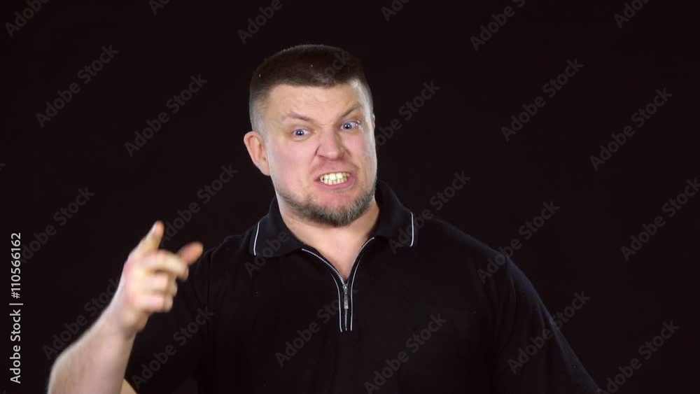 Angry man. Irritated man screaming. Black. Slow motion