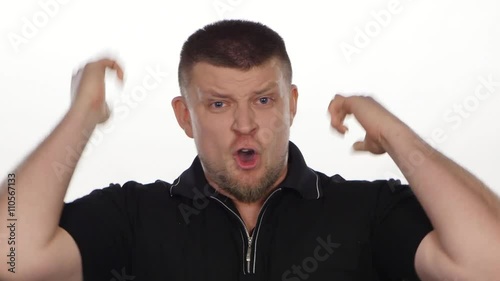 Angry man screaming and yelling. White photo