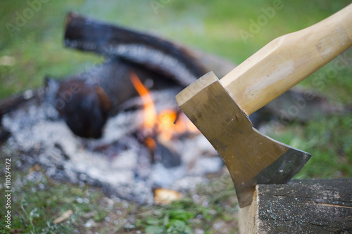 Camping in the woods with a fire ax in the summer.