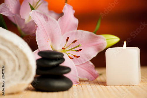 Spa concept of lily flower, towels, sea salt, candle and crystal