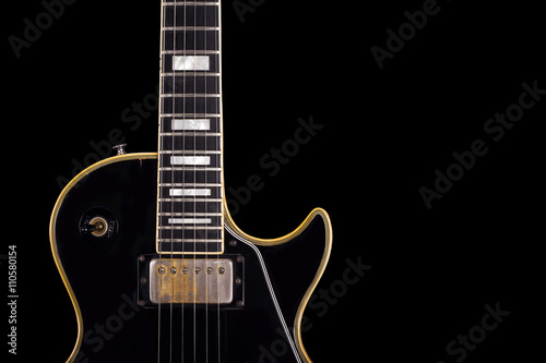 Black guitar on black background