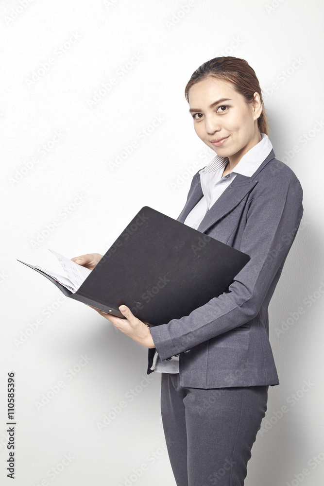 Young Business Women holding file standing Young Business Women holding file standing