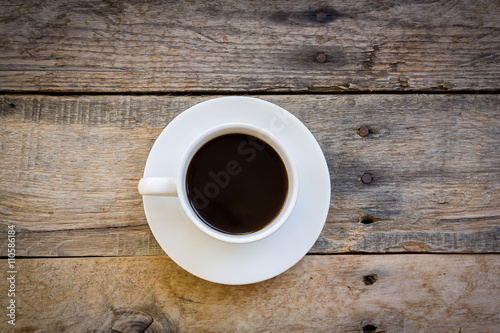 cup of coffee on wood table background