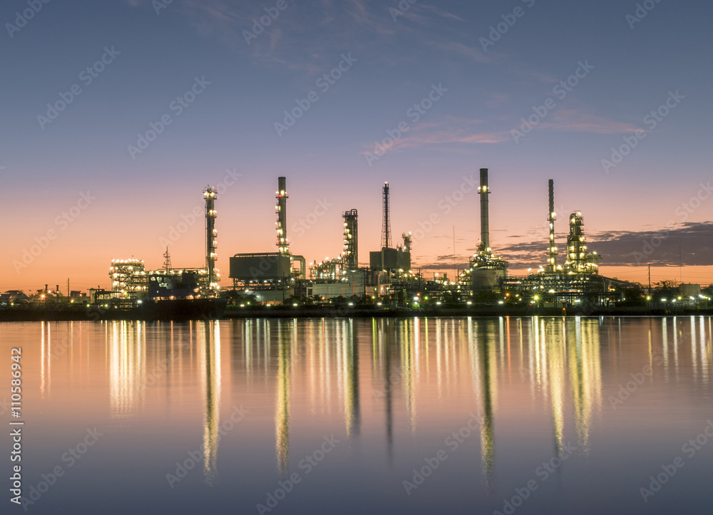 The energy refinery plant with water reflection