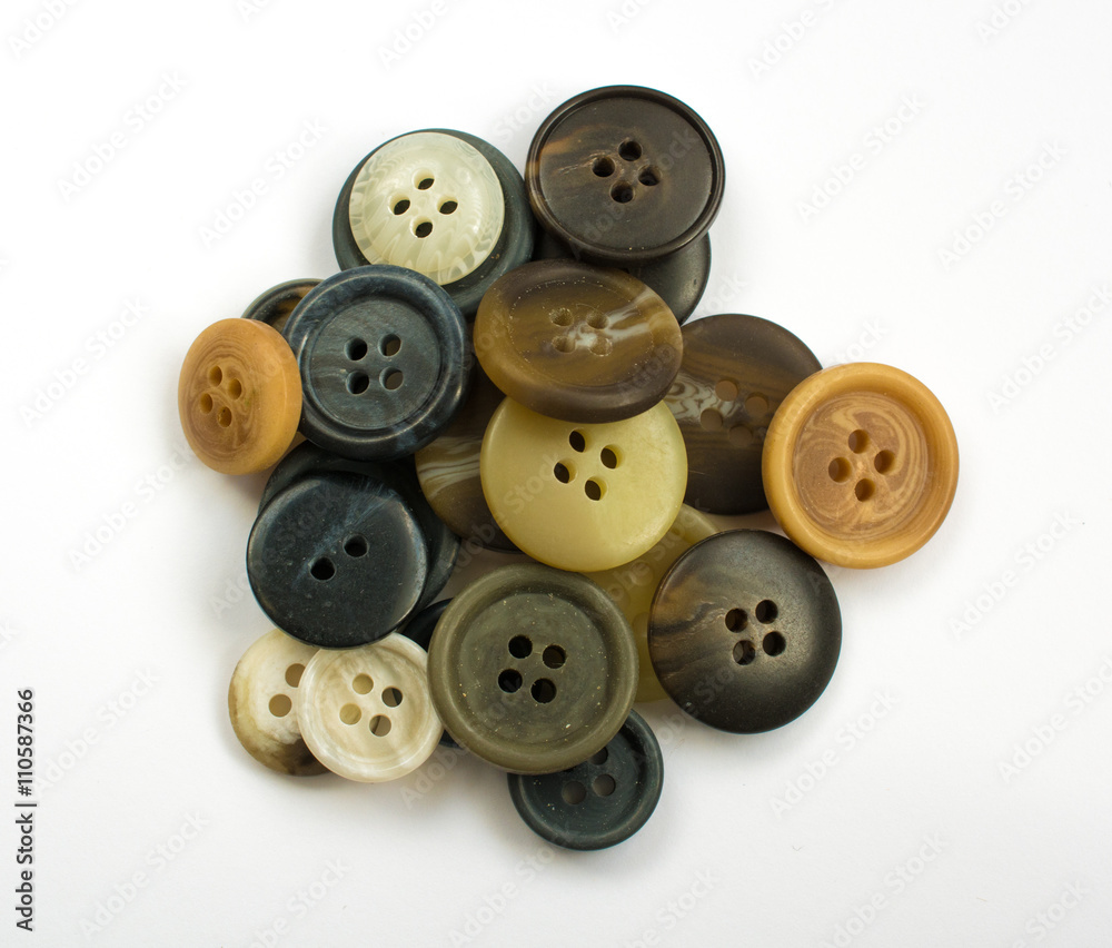 Pile of Assorted Dark Buttons Isolated on White Pile of Assorted Dark Buttons Isolated on White