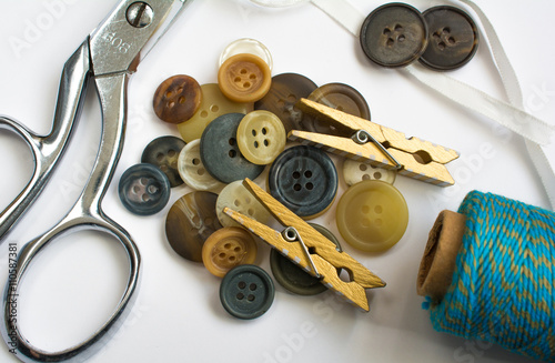 Pile of Buttons with Sewing Materials and Clothes Pins Isolated