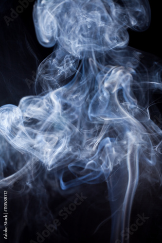 White smoke on black background.