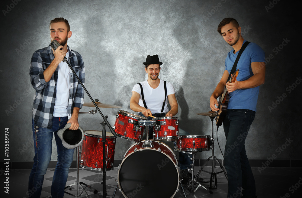 Musicians playing musical instruments and singing songs in a studio Musicians playing musical instruments and singing songs in a studio